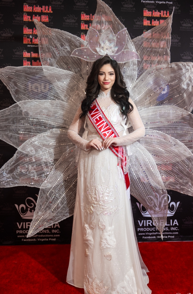 Attractive Asian woman in white ethereal dress